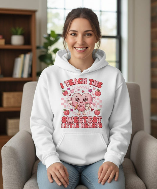 I Teach the Sweetest Little Hearts teaching Hoodie White lifestyle mockup
