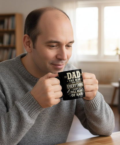 Dad the Man Who Has Everything Except a Full Head of Hair Funny Black Mug - lifestyle model mockup - Black