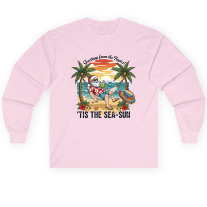 Greetings from the Tropics 'Tis the Sea-Sun santa claus on a tropical vacation Long Sleeve Tee Light Pink product mockup