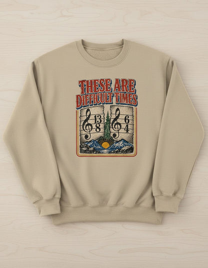 THESE ARE Difficult TIMES Funny Music Pun Sweatshirt - product mockup - Sand