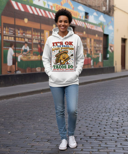 IT'S OK TO FALL APART Sometimes TACOS DO AND WE STILL LOVE THEM Hoodie - lifestyle model mockup - White