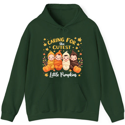Caring for the Cutest Little Pumpkins swaddled babies Hoodie Forest Green product mockup