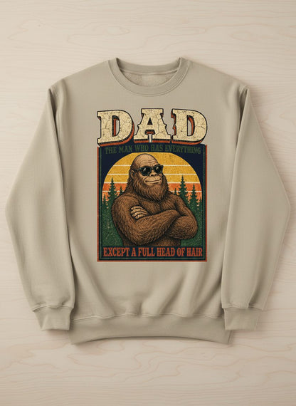 Dad the Man Who Has Everything Except a Full Head of Hair Funny Bigfoot Sweatshirt - product mockup - Sand