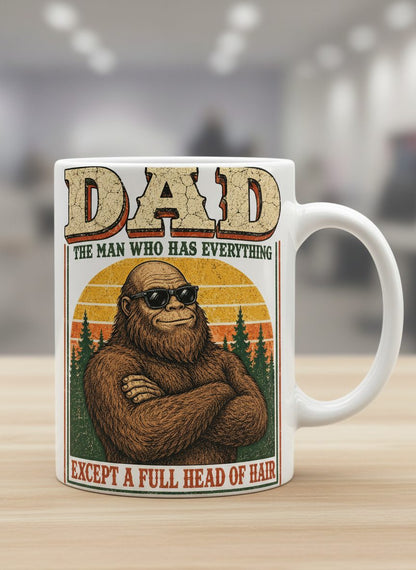 Dad the Man Who Has Everything Except a Full Head of Hair Funny Bigfoot White Mug - product mockup - White