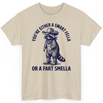 You're Either a Smart Fella or a Fart Smella cowboy raccoon T-Shirt Sand product mockup