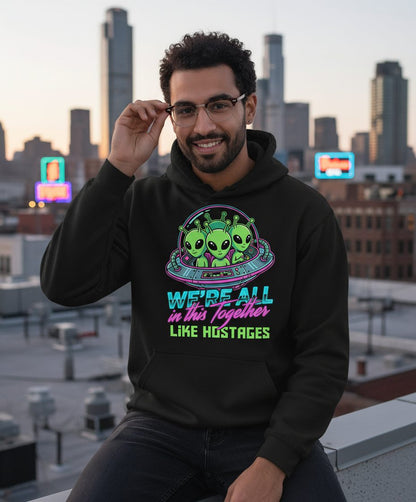 WE'RE ALL in this Together LIKE HOSTAGES Aliens Hoodie Black lifestyle mockup