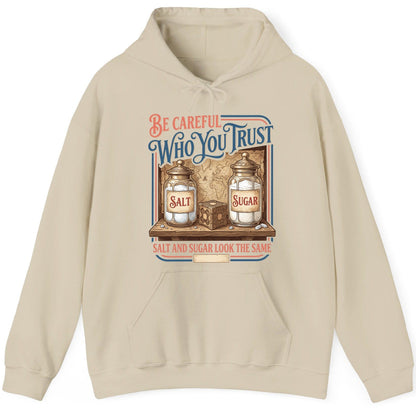 Be Careful Who You Trust Salt and Sugar Look the Same Hoodie - product mockup - Sand