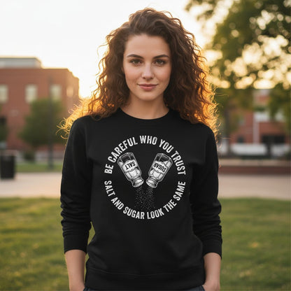 BE Careful WHO YOU TRUST SALT AND SUGAR LOOK THE SAME Sweatshirt - lifestyle model mockup - Black