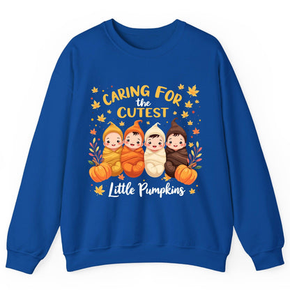 Caring for the Cutest Little Pumpkins swaddled babies Sweatshirt Royal product mockup