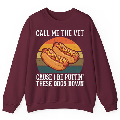 Call Me the Vet Cause I Be Puttin' These Dogs Down hot dogs Sweatshirt Maroon product mockup