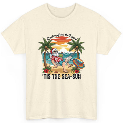 Greetings from the Tropics 'Tis the Sea-Sun santa claus on a tropical vacation T-Shirt Natural product mockup