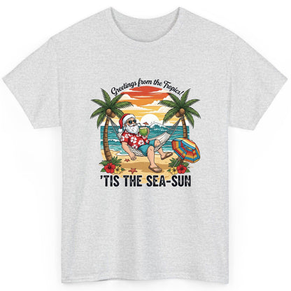 Greetings from the Tropics 'Tis the Sea-Sun santa claus on a tropical vacation T-Shirt Ash product mockup