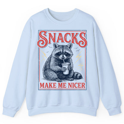SNACKS MAKE ME NICER Funny Raccoon Sweatshirt - product mockup - Light Blue