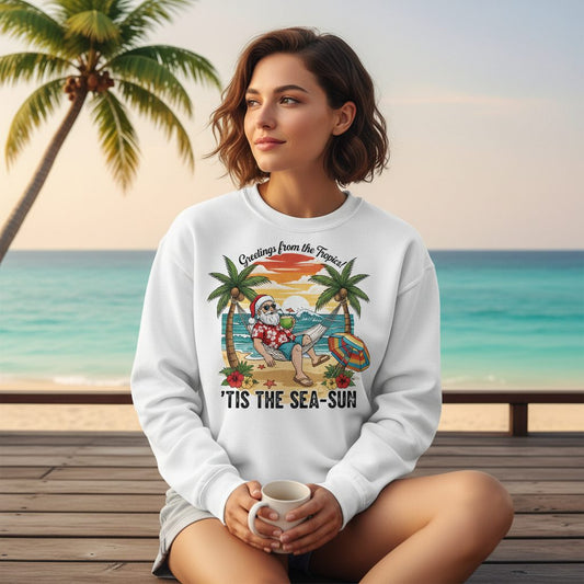Greetings from the Tropics 'Tis the Sea-Sun santa claus on a tropical vacation Sweatshirt White lifestyle mockup