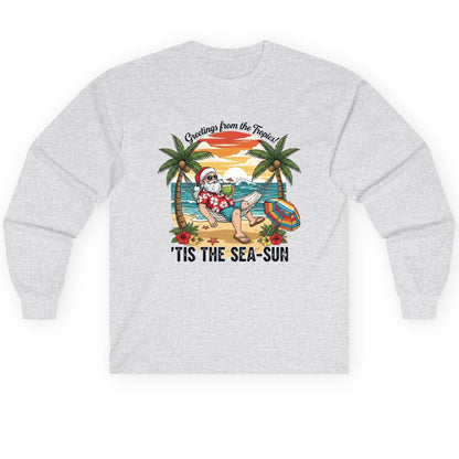 Greetings from the Tropics 'Tis the Sea-Sun santa claus on a tropical vacation Long Sleeve Tee Ash product mockup