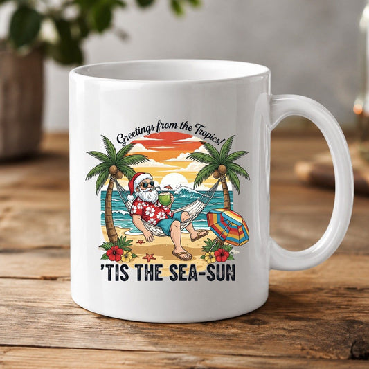 Greetings from the Tropics 'Tis the Sea-Sun santa claus on a tropical vacation White Mug White product mockup