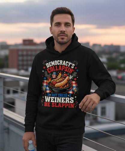 Democracy's Collapsin' but These Weiners Be Slappin' Funny 4th Hoodie - lifestyle model mockup - Black