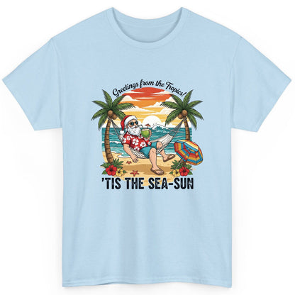 Greetings from the Tropics 'Tis the Sea-Sun santa claus on a tropical vacation T-Shirt Light Blue product mockup