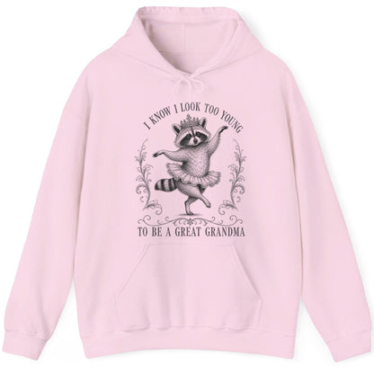 I KNOW I LOOK TOO YOUNG TO BE a GREAT Grandma Funny Raccoon Hoodie - product mockup - Light Pink