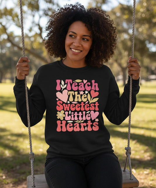 I Teach the Sweetest Little Hearts teaching Sweatshirt Black lifestyle mockup